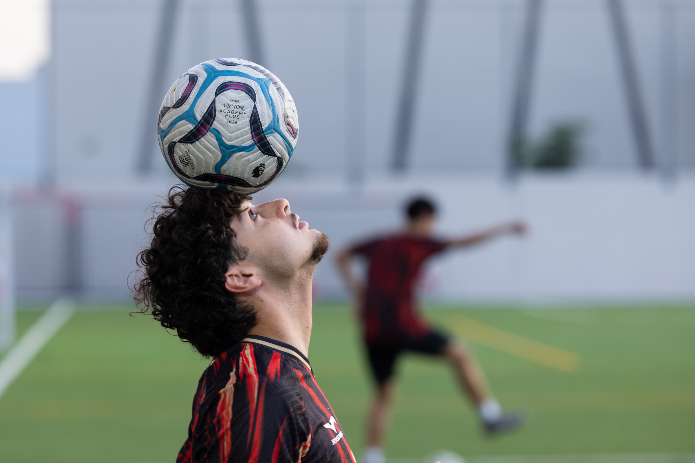 Footballer balancing a ball during training